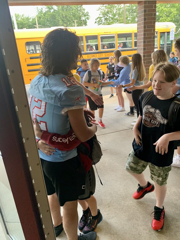 Athletes welcoming students to school